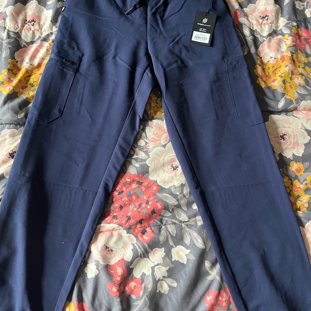 Navy jannuu cargo scrubs with elastic waistband. Brand new